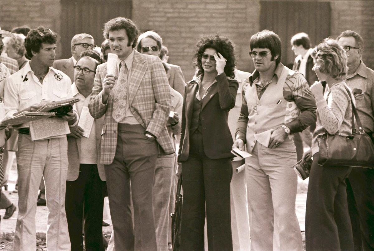 During Keeneland’s Fall Meet in October 1976 two members of Cincinnati’s “Big Red Machine,” Pete Rose and Doug Flynn, paid a visit to the Lexington track. The Reds had just won the National League Championship Series against the Philadelphia Phillies the day before and were about to make history in the World Series, sweeping the New York Yankees in four games, to win back-to-back World Series. The group shown here in the Keeneland paddock included, from left, Doug Flynn, the Reds’ utility infielder, Mario Nunez, a friend of Rose’s known as “The Cuban,” Tom Hammond, then sports director for WLEX-TV, Teri Rubio, a friend of Rose’s and Pete Rose.