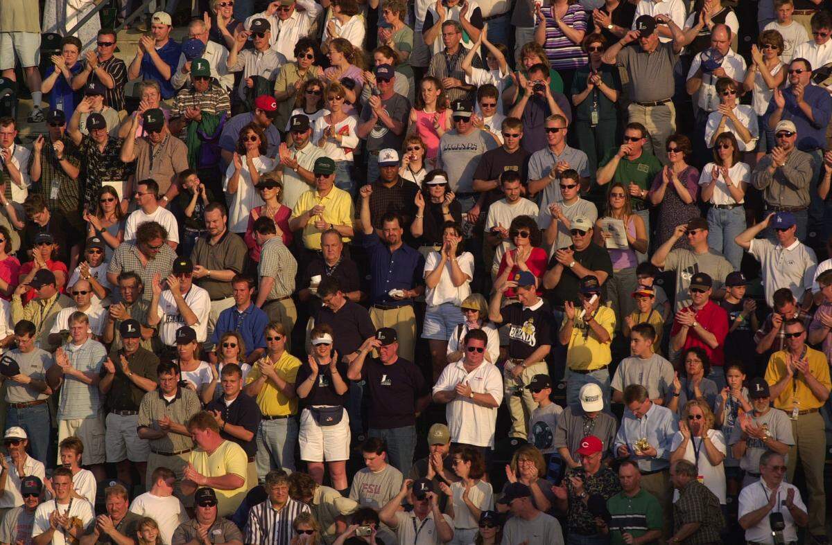 Fans cheer following the national anthem as the Lexington Legends prepare to play the Hagerstown Suns in their home opener on April 9, 2001 at Applebee’s Park.