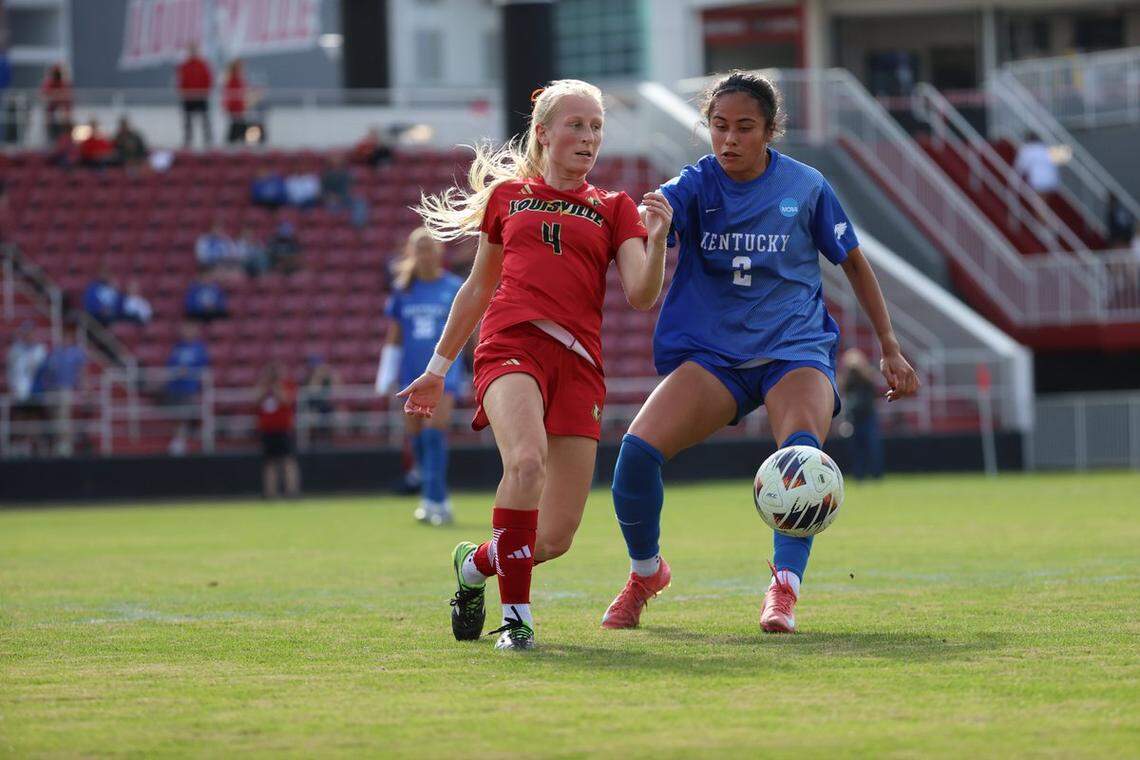 Louisville women’s soccer junior midfielder Liza Suydam battles for the ball against Kentucky senior midfielder Skye Leach during an NCAA Tournament first-round match on Saturday at Lynn Stadium in Louisville.