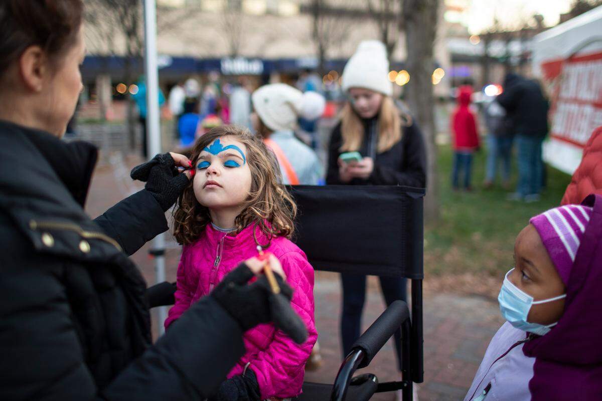Farrah Meek, 4, closed her eyes while having her face painted.
