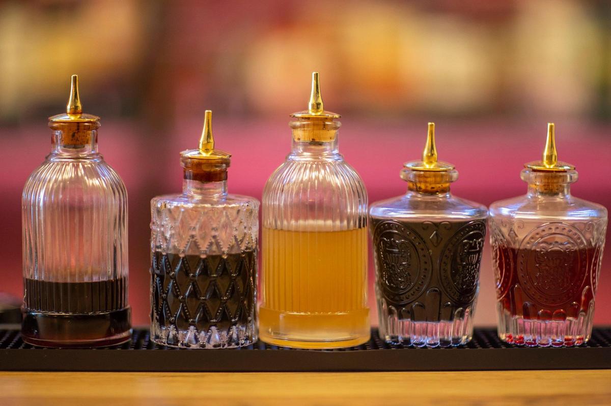Syrups sit on the bar at George’s Social House in downtown Lexington, Ky., on Monday, April 24, 2023.