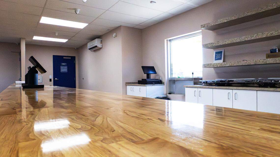 Hardwood countertops provide a spacious work surface between the service counter and drive-through window at Blue Sage, a new medical marijuana dispensary set to open on 172 Imperial Way, in Nicholasville, Ky,  on Jan. 12, 2026.
