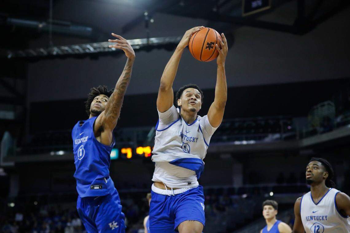 Tre Mitchell grabbed a rebound over teammate Jordan Burks during the Kentucky basketball Blue-White Game.