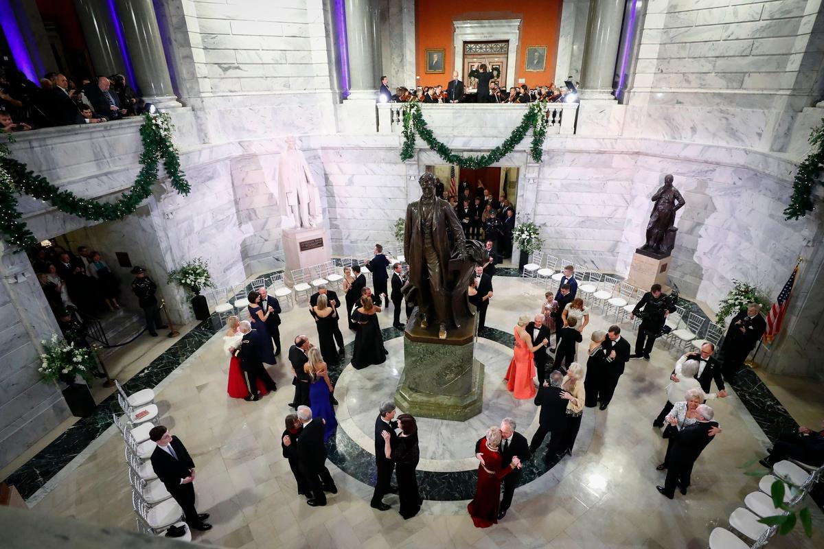 Kentucky Gov. Andy Beshear and other elected officials dance in the Capitol rotunda following the Grand March in the state Capitol in Frankfort, Ky., Tuesday, Dec. 10, 2019.