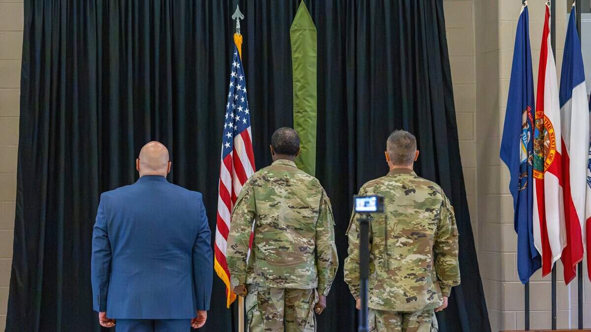 Director of the United States Chemical Material Command (CMA), Mr. Kelso Horne, stands at attention with Sergeant Major Paul J. Eillis and outgoing commander, Lieutenant Colonel David A. Dellerman, as they honor the Blue Grass Chemical Activity's colors being cased during the deactivation ceremony of the Blue Grass Chemical Activity located on the Army Reserve Forces Center installation in Richmond, Ky, on June 24, 2026.