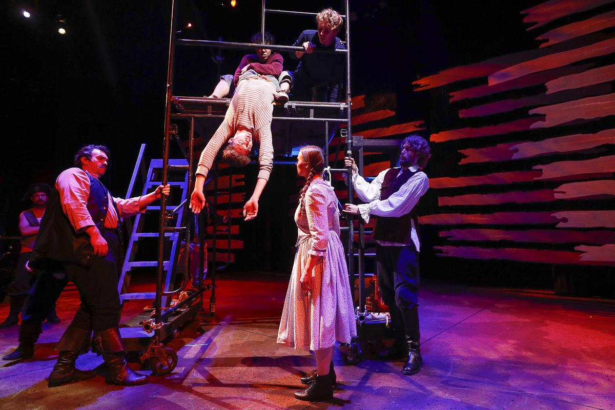 Nick Vannoy, playing the role of Black Stache, from left, Jordan Strouse, playing Peter, Wylie Caudill, playing Teddy, Kelsey Waltermire, playing Molly Aster, and Forrest Loeffler, playing the roles of Grempkin, Sanchez, Mack, and Hawking Clam act out a scene during rehearsal for Peter and the Starcatcher at the Woodford Theatre in Versailles.
