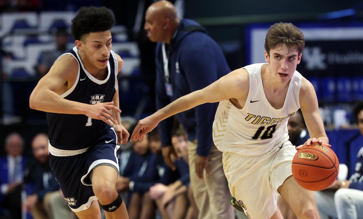Murray’s Grant Whitaker (10) is pressured by Warren Central’s Izayiah Villafuerte (1) during Friday night’s final quarterfinal game in Rupp Arena. Whitaker led Murray with 23 points.