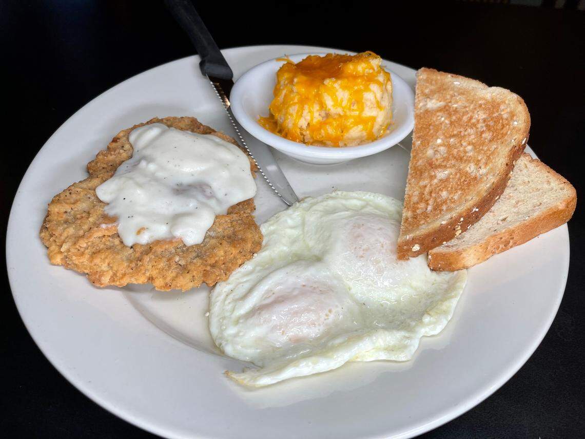 Lexington Diner’s Country Fried Steak and Eggs. Country fried steak smothered in country gravy, two eggs, choice of bread and side. Shown with Wheatberry toast and cheese and garlic grits. You can still eat there through March 19.