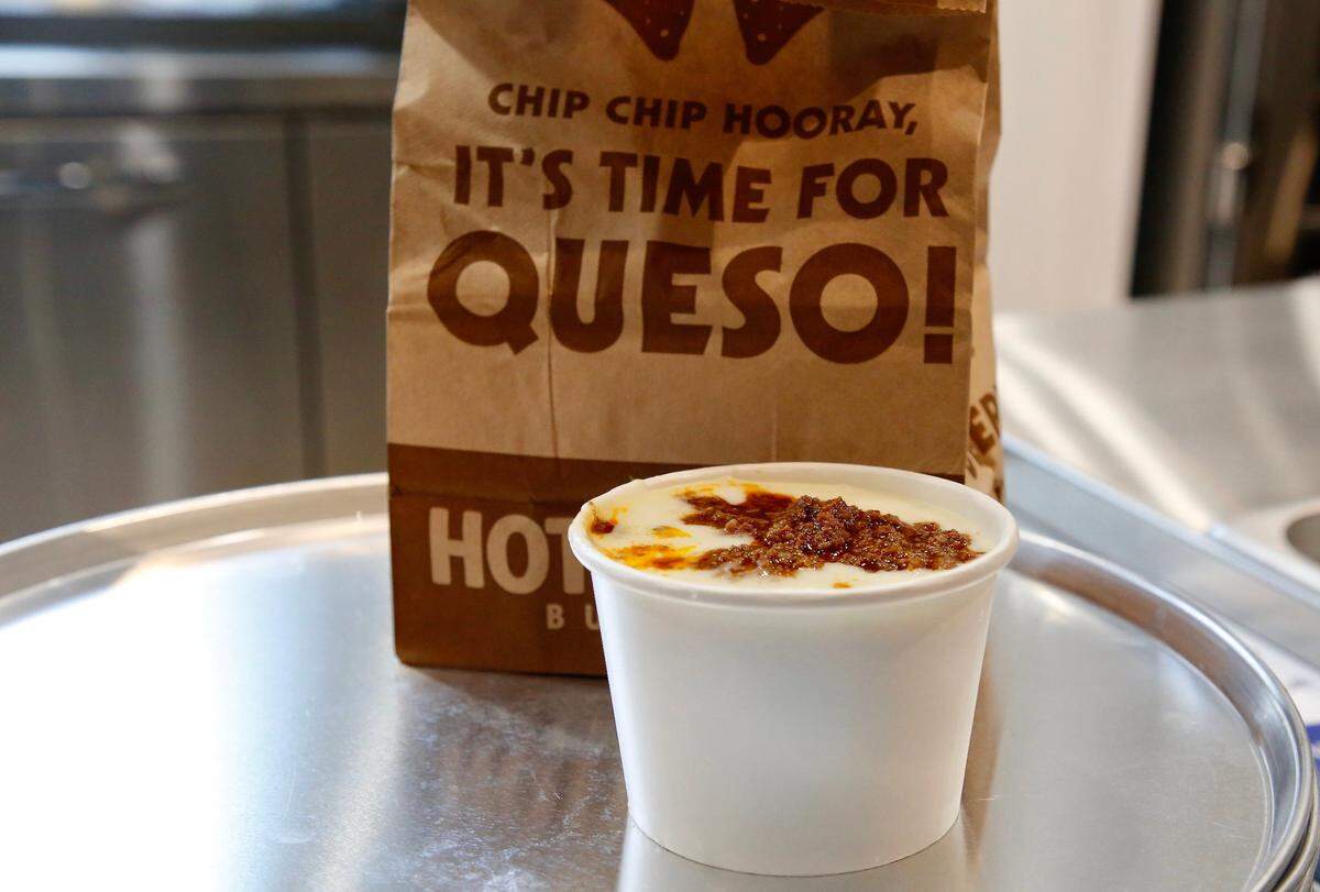 A side of queso with beef at Hot Head Burritos new Lexington location off Newtown Pike. You can customize your queso to include any toppings.