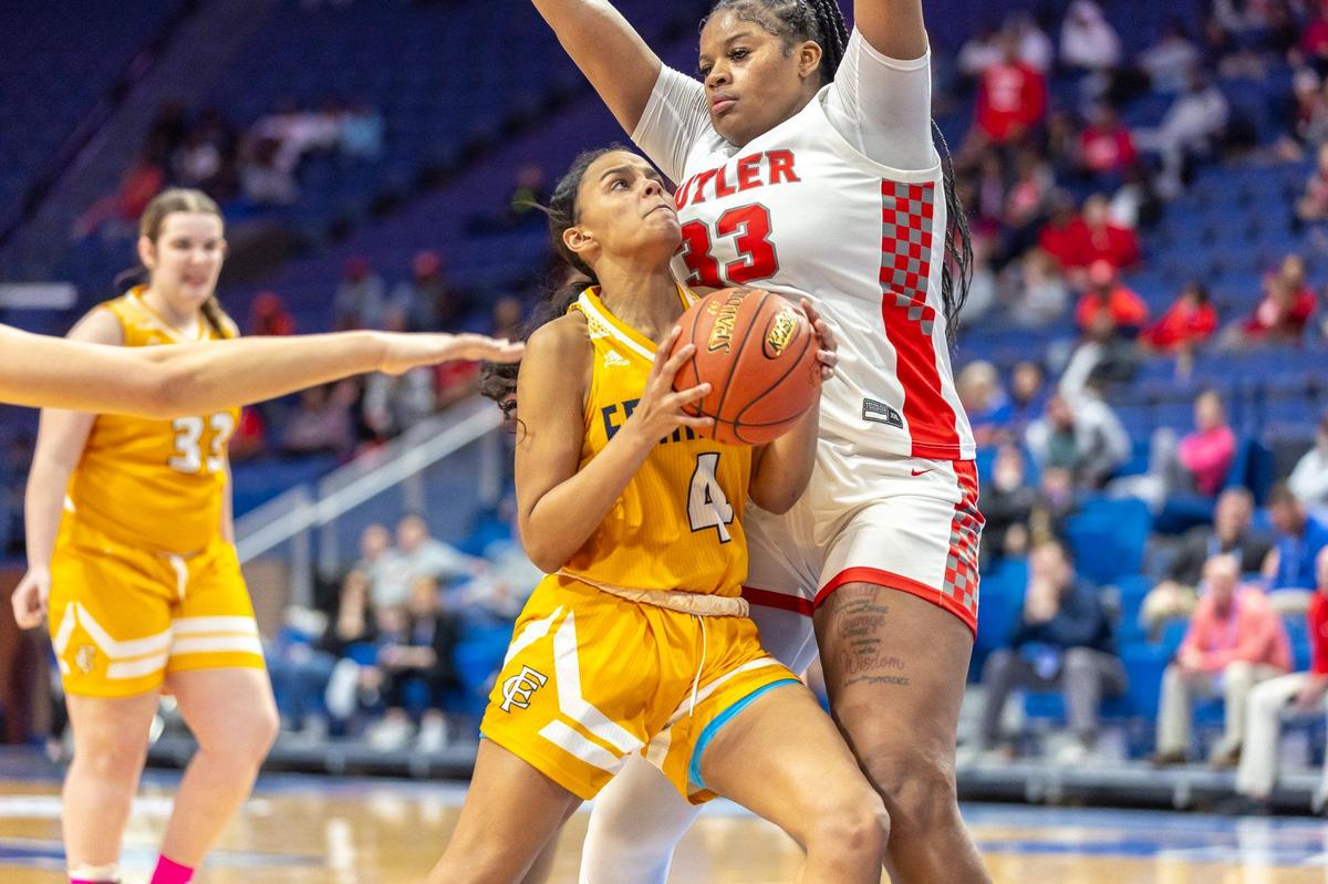 Franklin County’s Madison Jackson (4) tries to drive against Butler’s Ramiya White (33) during Friday’s quarterfinals. White led Butler into the semifinals with with 19 points, 12 rebounds and five blocks