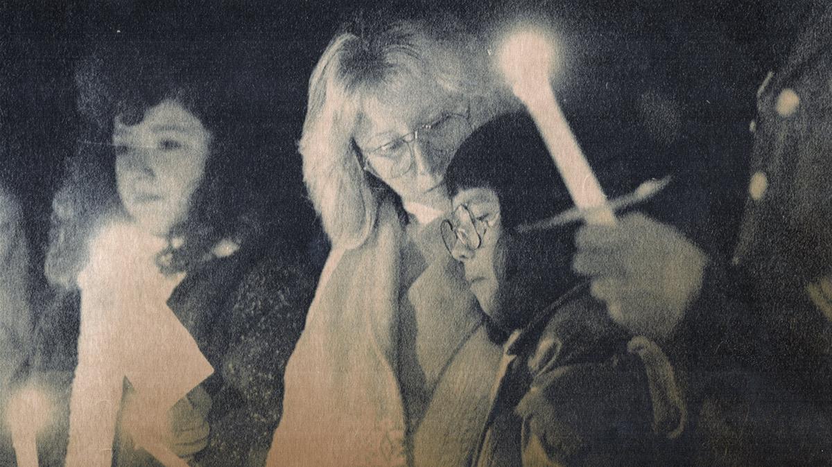On November 26, 1989 a candlelight vigil was held for Alexandria Suleski, a 5-year-old Radcliff girl missing since October 25. About 150 people attended the vigil in Radcliff, including Alexandria's sister Nyssa, 12, right, her mother, Roxanne, center and sister Dawn, 9. The vigil was held on Alexandria's sixth birthday. Photo by David Perry | Staff