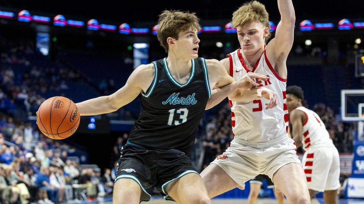 North Oldham's Thomas Gregg (13) looks for an outlet pass around the defense of Butler's Brayden Wilkins (5) during a quarterfinal round game in the 2026 UK Healthcare Boys' Basketball Sweet 16 state tournament, Friday, March 20, 2026 at Rupp Arena in Lexington, Ky.