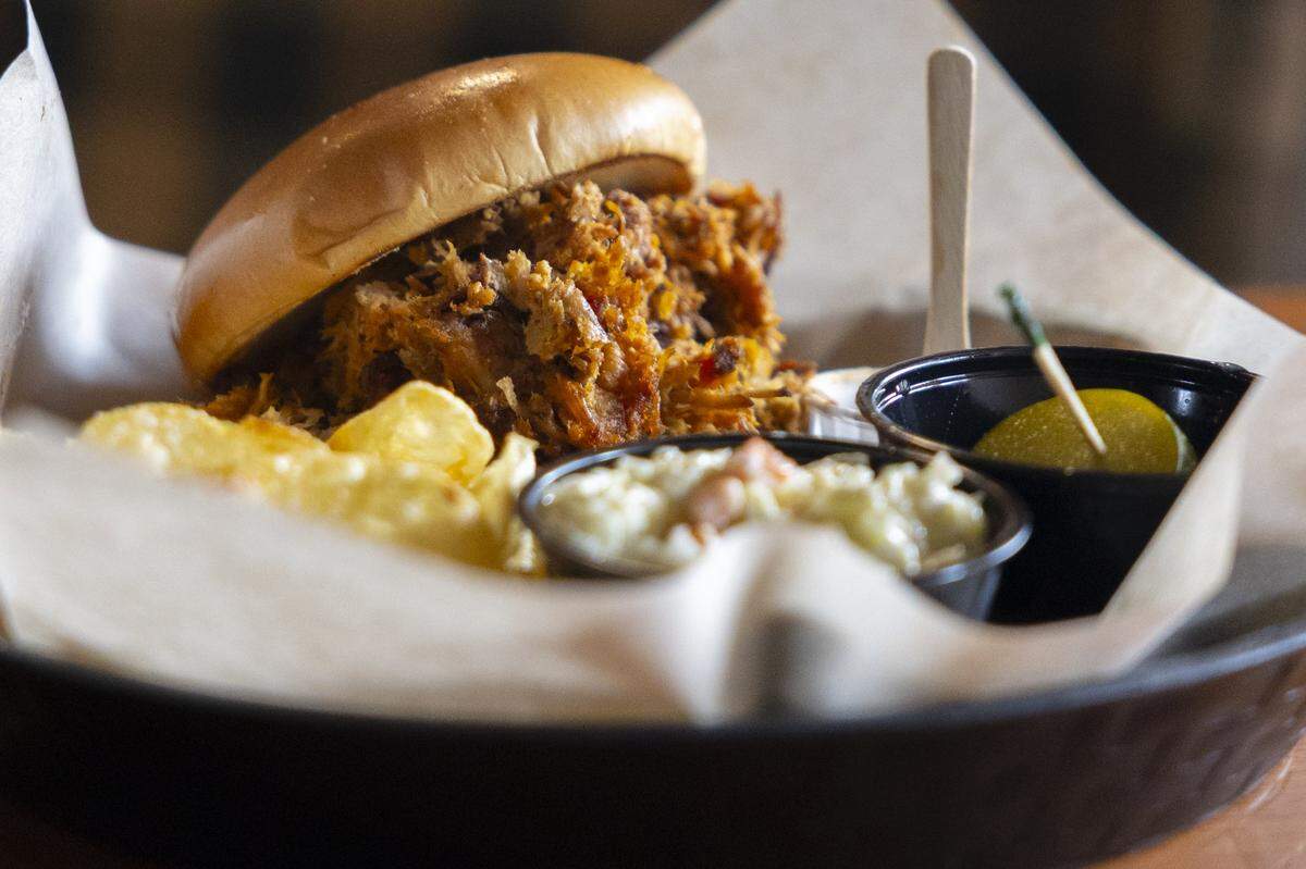 Elkhorn Tavern's pulled pork sandwich is made with slow-smoked pork on a toasted bun with barrel house bourbon BBQ sauce.