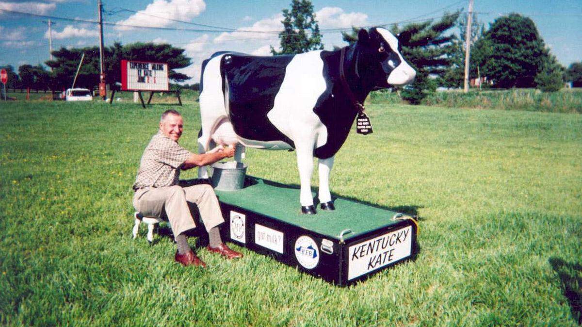Rodger Bingham mugged with Kentucky Kate, the fiberglass cow that was used to kick off Dairy Month 
in June 2004. Bingham took a job in the Kentucky Department of Agriculture earlier that year.