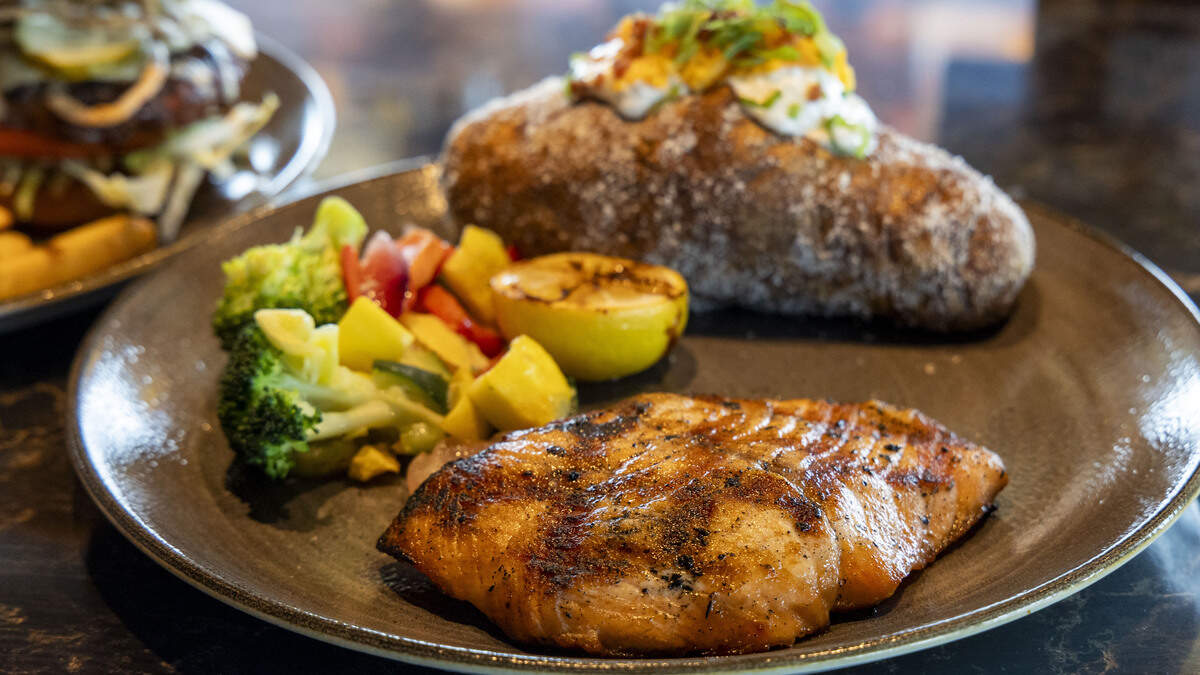 Wood Grilled Salmon ($29.95) at Firebirds Wood Fired Grill, topped with Key lime butter and served with fresh vegetables and a loaded baked potato. The new Lexington contemporary restaurant is opening June 16 in Hamburg in front of Cabela’s and near Costco.