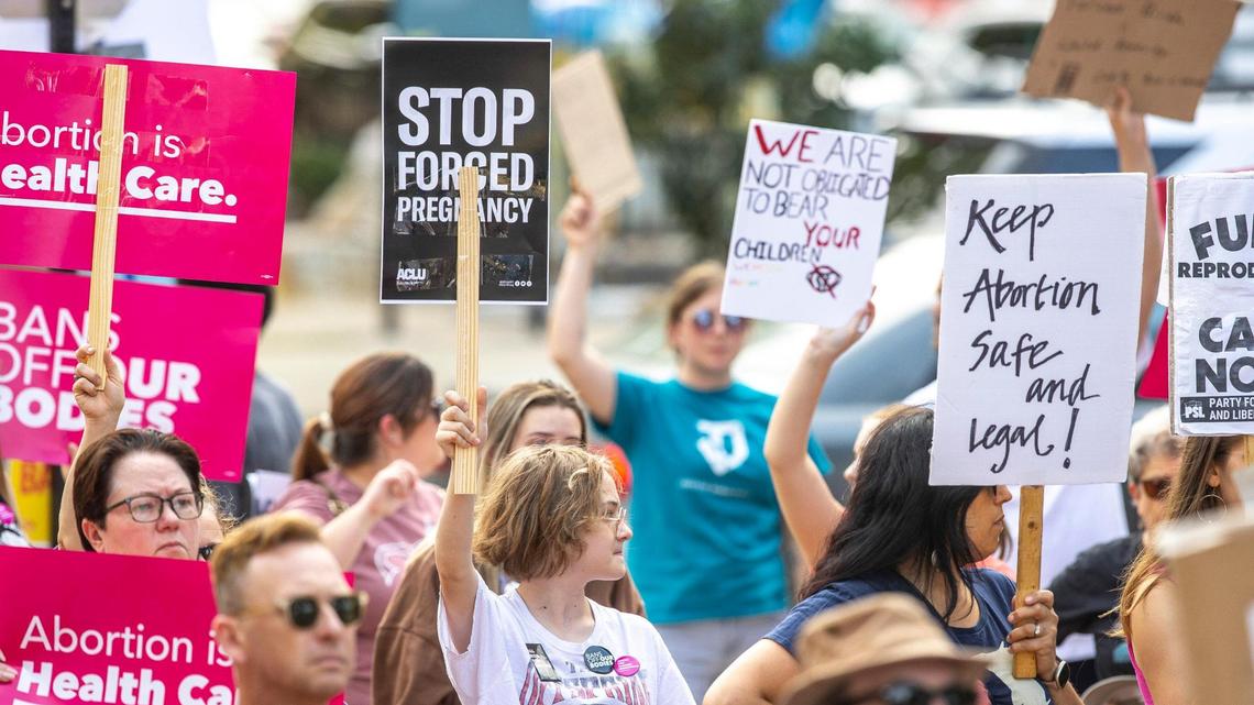 People gather near Robert F. Stephens Courthouse Plaza in downtown Lexington, Ky., on Friday, June 24, 2022 to protest the U.S. Supreme Court’s overturning of Roe v. Wade.