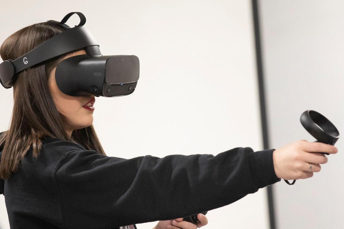 Kayce Campbell, a sophomore at Perry County Central High School, uses one of the school’s new virtual reality consoles Wednesday, Dec. 4, 2019, in Hazard, Ky.
