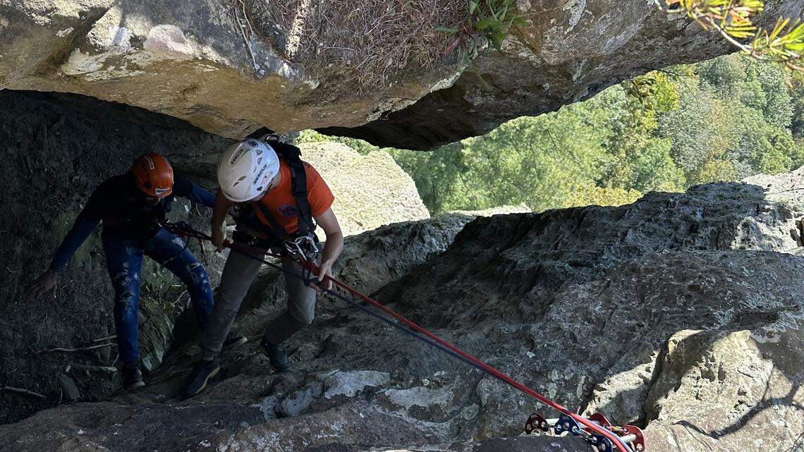 The climber was “extremely lucky” he hadn’t fallen off the 200-foot cliff next to him, rescuers said.