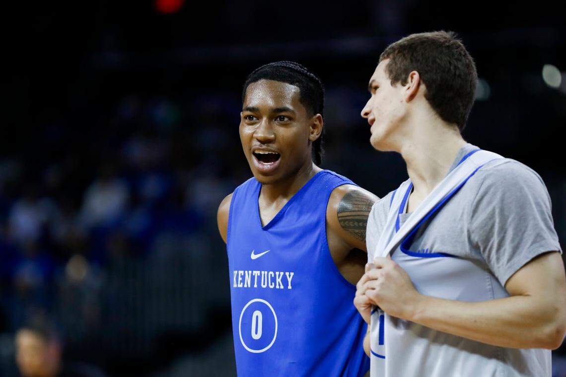 Rob Dillingham, left, scored 40 points in the Kentucky basketball Blue-White Game on Saturday night.