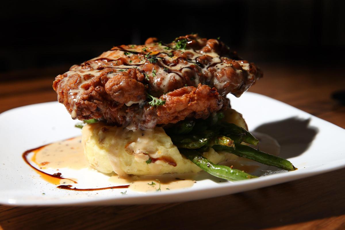 Buttermilk brined fried chicken with Yukon mashed potatoes, green beans and pepper gravy is the most popular item at Graze.