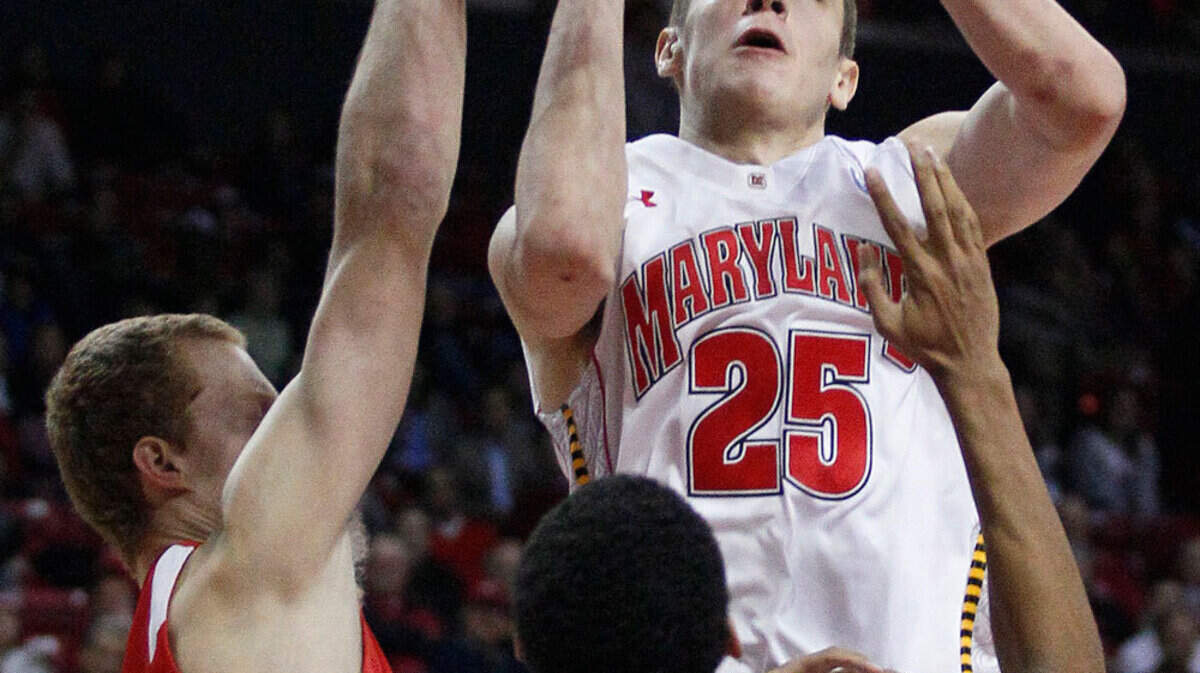 Maryland center Alex Len (25), of Ukraine, shoots over Cornell guard Devin Cherry, bottom left, and forward Shonn Miller in the second half of an NCAA college basketball game in College Park, Md., Tuesday, Jan. 3, 2012. Len contributed 15 points to Maryland's 70-62 win.