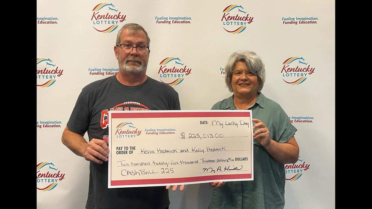 Siblings Kevin and Kelly Hedrick pose with their big check from Kentucky Lottery after a recent jackpot win on the Cash Ball 225 drawing game.