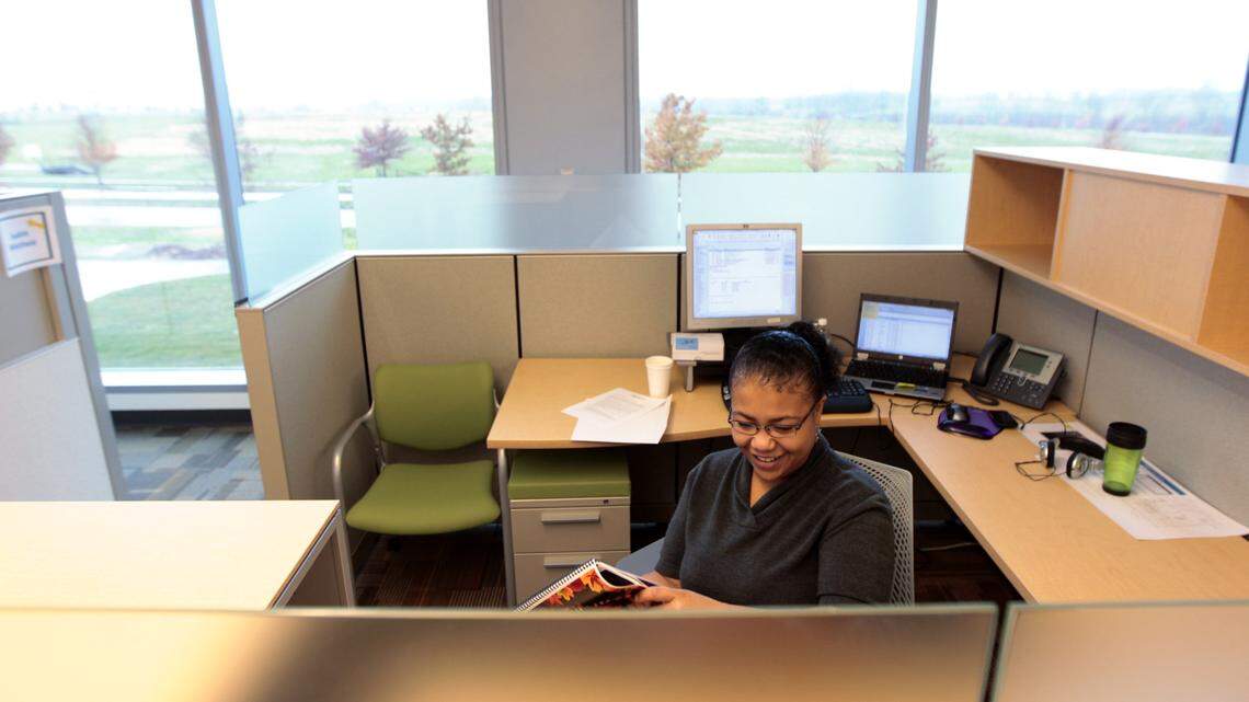 Customer-service supervisor LeShai Phelps got acquainted Monday with her new cubicle.