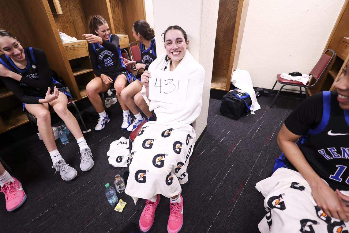 Georgia Amoore dries off after a water-bottle dousing from her teammates following her career-high 43-point effort at Oklahoma on Sunday.