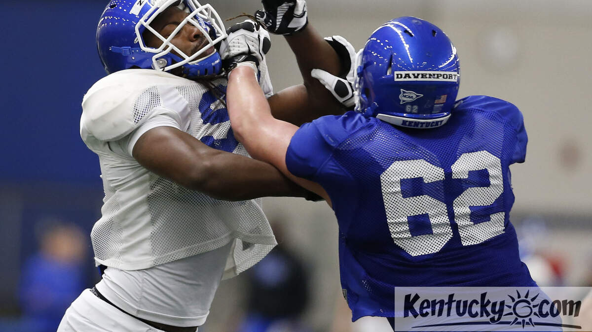 UK lineman Tyler Davenport, 62, tried to keep Za'Darius Smith at bay  at practice  on Wednesday March 27, 2013 in Lexington, Ky. Photo by Mark Cornelison | Staff