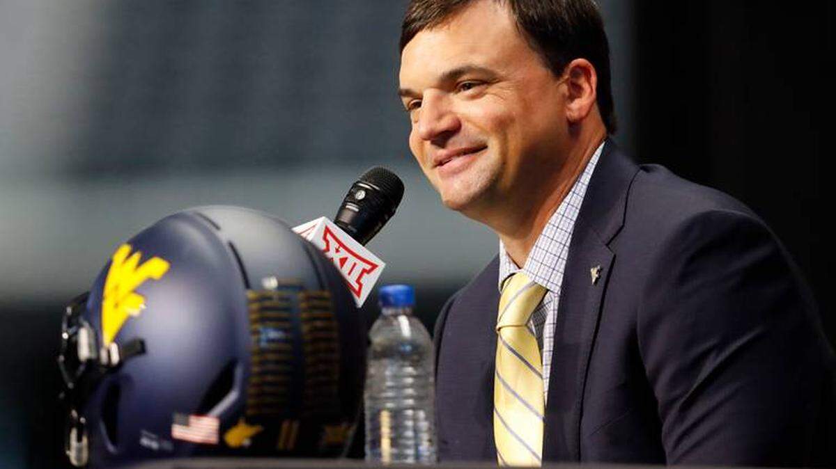 West Virginia football coach Neal Brown has had his defensive coordinator, Vic Koenning, placed on administrative leave over allegations of insensitive remarks.