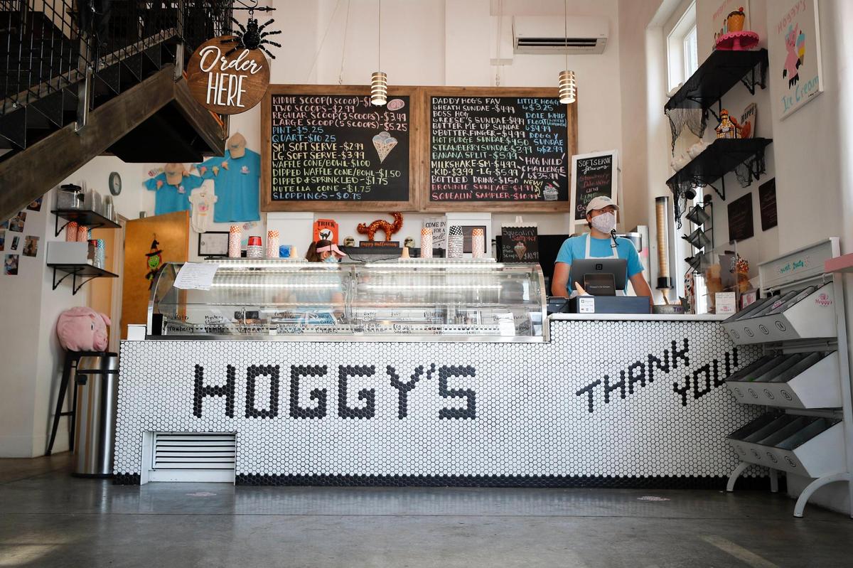 Jackson Williams-Hale, 17, of Frankfort, stands behind the counter at Hoggy’s. They offer 20 flavors of ice cream, which rotate on a weekly basis.