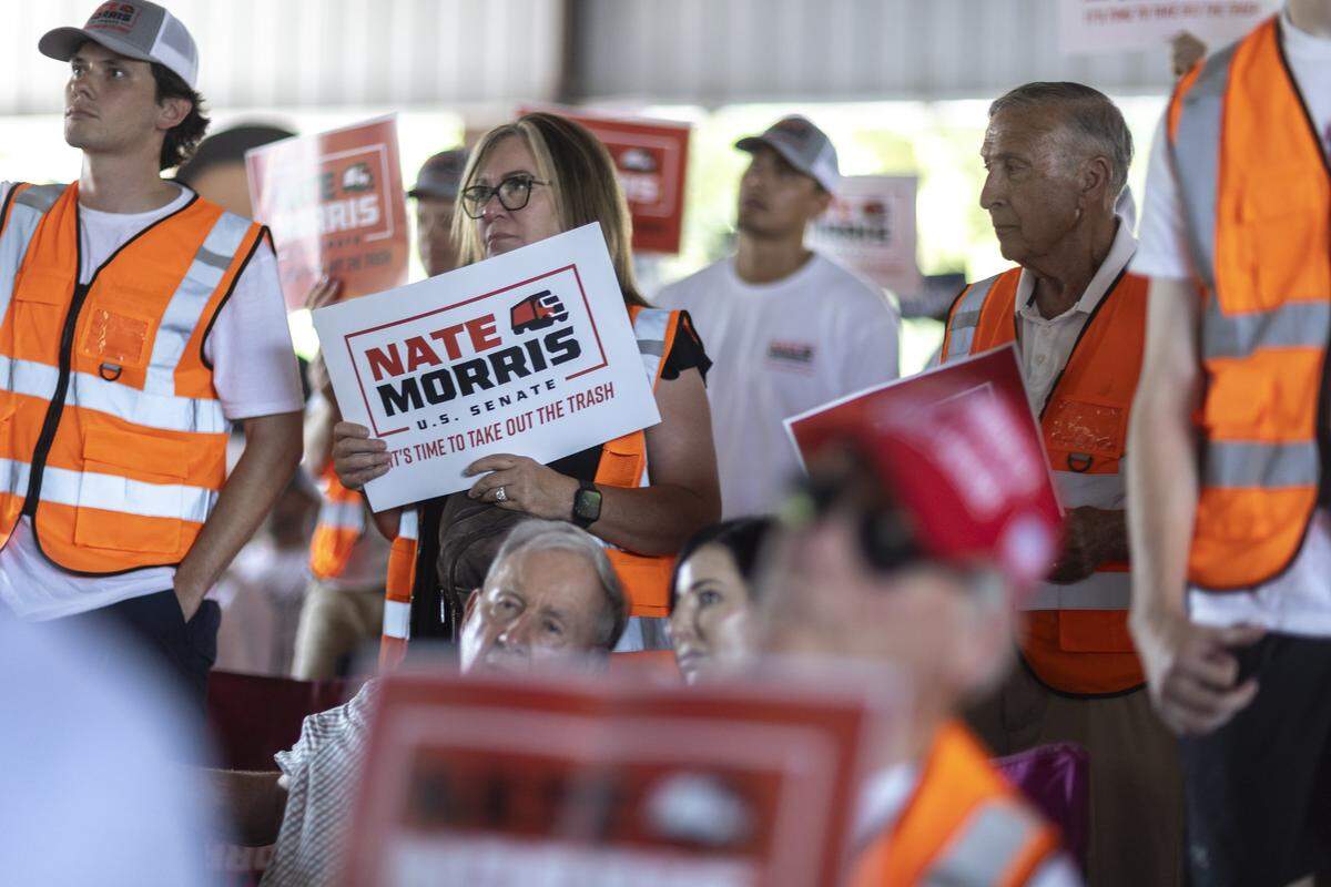 Supporters of Nate Morris, a candidate for U.S. Senate, listen as Morris delivers a speech at the 145th annual St. Jerome Fancy Farm Picnic in Fancy Farm, Ky., on Saturday, Aug. 2, 2025.