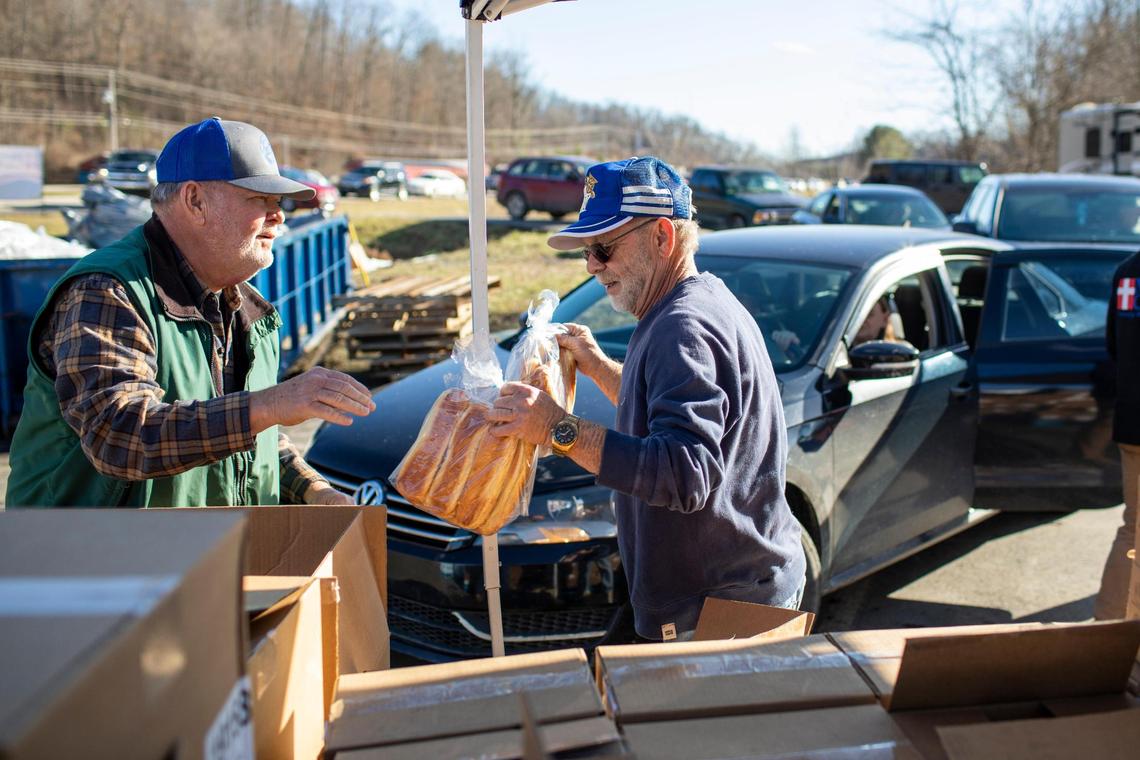 Volunteers with Mercy Chefs and the Hazel Green Food project work to serve hot meals, food supplies and water at The Hazel Green Food Project in Wolfe County, Ky., Thursday, January 19, 2023.