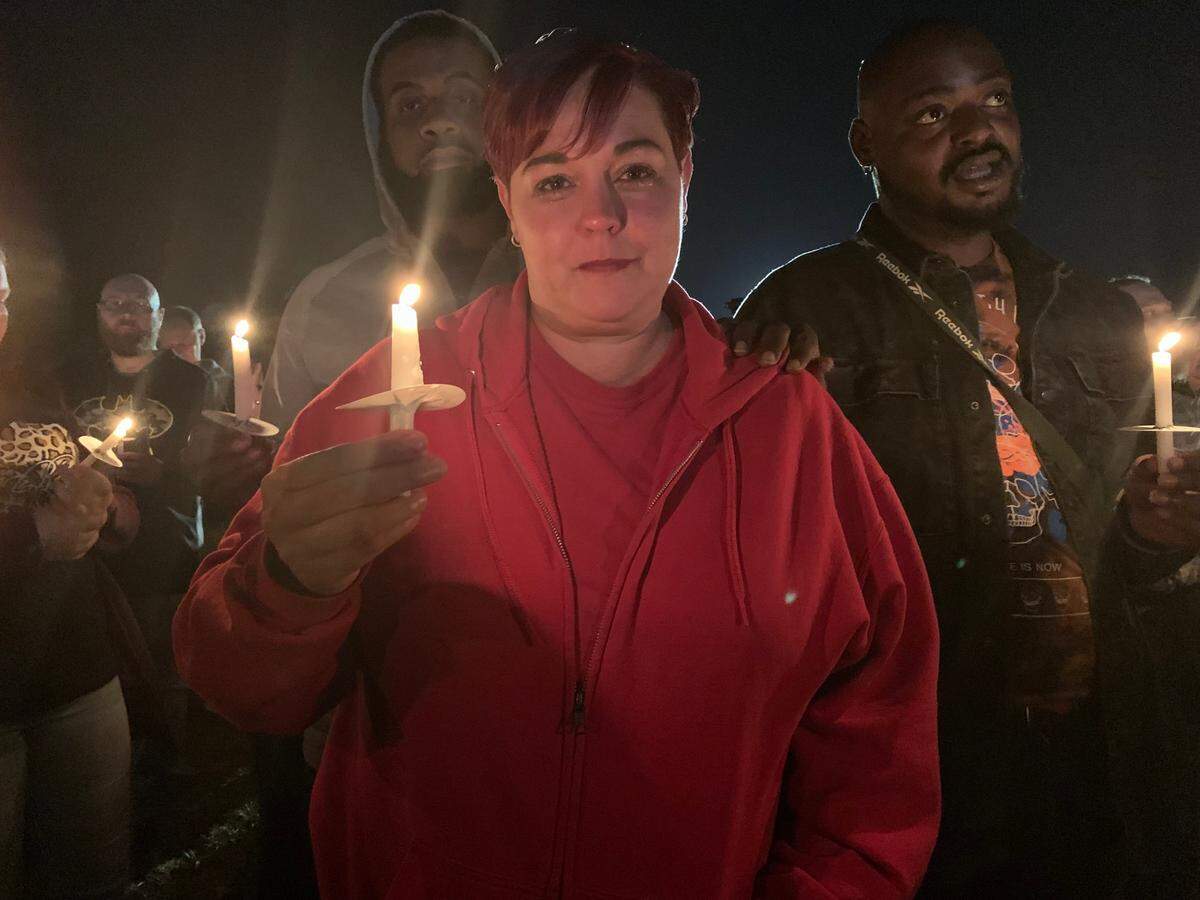 Brandi Moss, comforted by Calvin Ramsey, is a supervisor at the Mayfield candle factory. She said she knew all eight people that died there on Friday night.