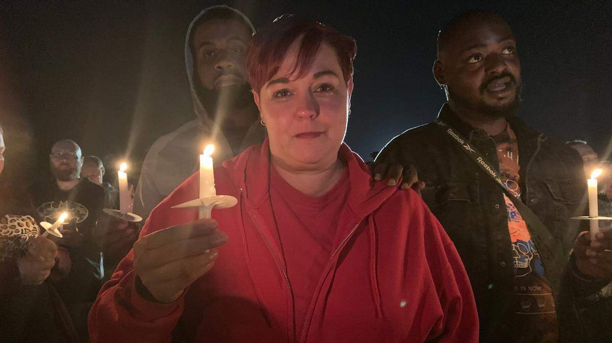 Brandi Moss, comforted by Calvin Ramsey, is a supervisor at the Mayfield candle factory. She said she knew all eight people that died there on Friday night.