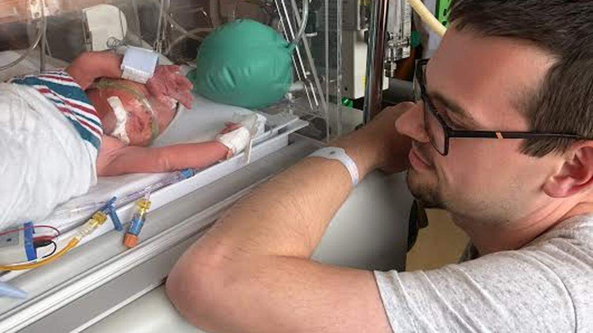 Jordan Hall of Hindman, Kentucky, visits with his son Noah Hall, who was born prematurely Saturday July 13. Hall has had many supporters nationwide as he chronicled on Facebook his son’s birth and his wife’s death from unexpected pregnancy complications.