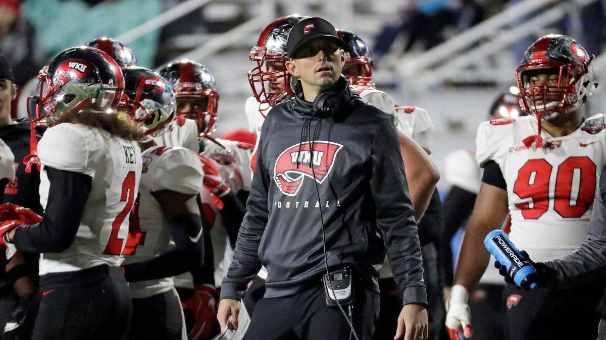 Western Kentucky Coach Mike Sanford looked at the scoreboard during his team’s 29-10 loss to Middle Tennessee on Nov. 2.