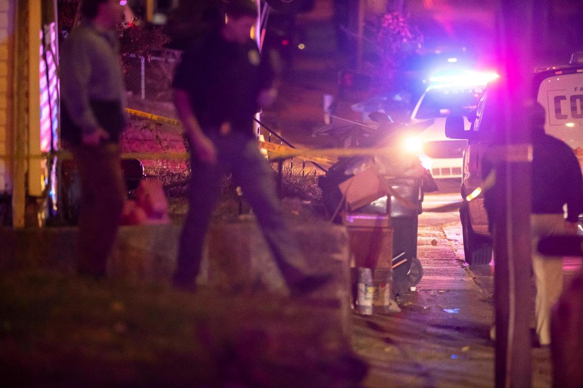 Members of law enforcement and the coroner’s office respond to a home in the 700 block of Maple Avenue in Lexington, Ky., on Tuesday, Oct. 25, 2022.