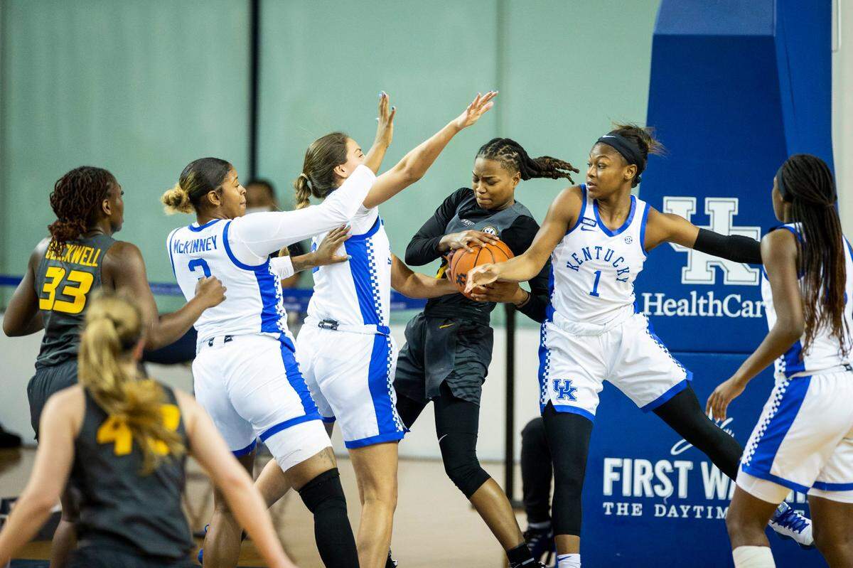 Kentucky’s Robyn Benton (1) tried to grab a rebound from Missouri’s Shug Dickson during Sunday’s Wildcats win in Memorial Coliseum. UK has focused its attention of late on improving its defense in the paint and rebounding better. UK enters Thursday night’s game at Ole Miss tied for fourth place in the SEC.