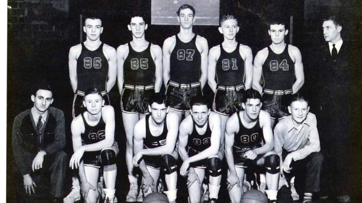 Members of the 1941-42 Walton-Verona basketball team. From left to right, front row: J.O. Dungeon, manager; Charles “Hunky” Holder, Cliff Ryan, Harry D. Mayhugh, Ray Coyle, Jesse Thornon (manager). From left to right, back row: Lawrence Welsh, Stanley McElroy, Truett Demoisey, Russell Groger, Paul Simpson, head coach Lewis Shields.