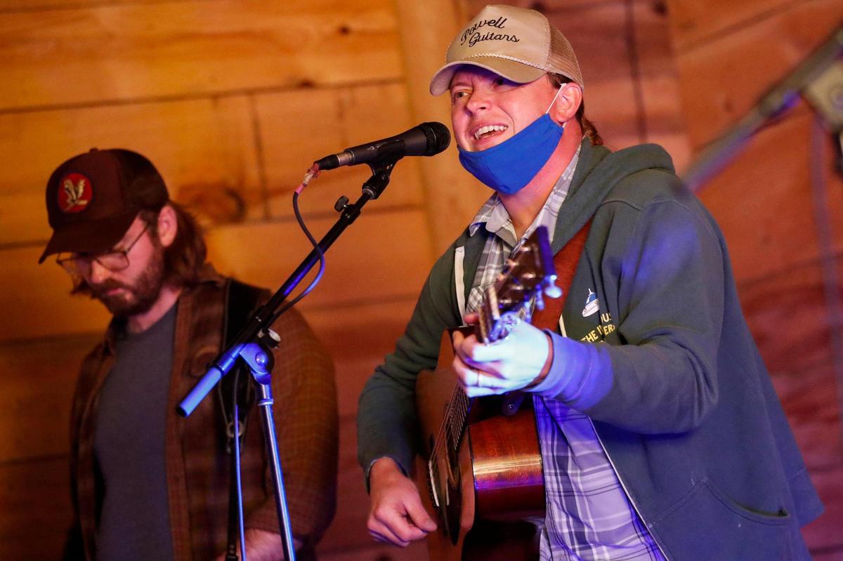 Allen Cooke, left, and C.J. Cain rehearse Wednesday. “We’re just thrilled to be back in front of fans performing for the first time in nearly eight months and giving them a taste of our new sound,” Cain said.