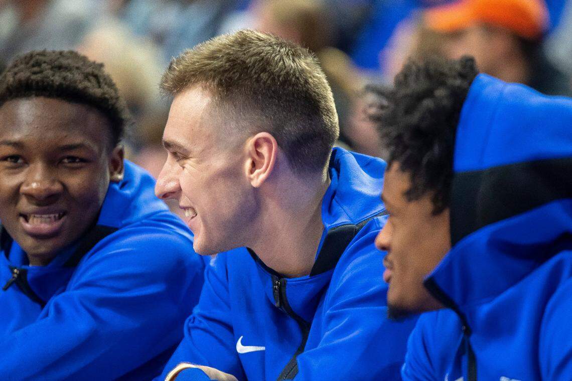 Kentucky’s Brennan Canada talks with his UK teammates on the bench during a game earlier this season.