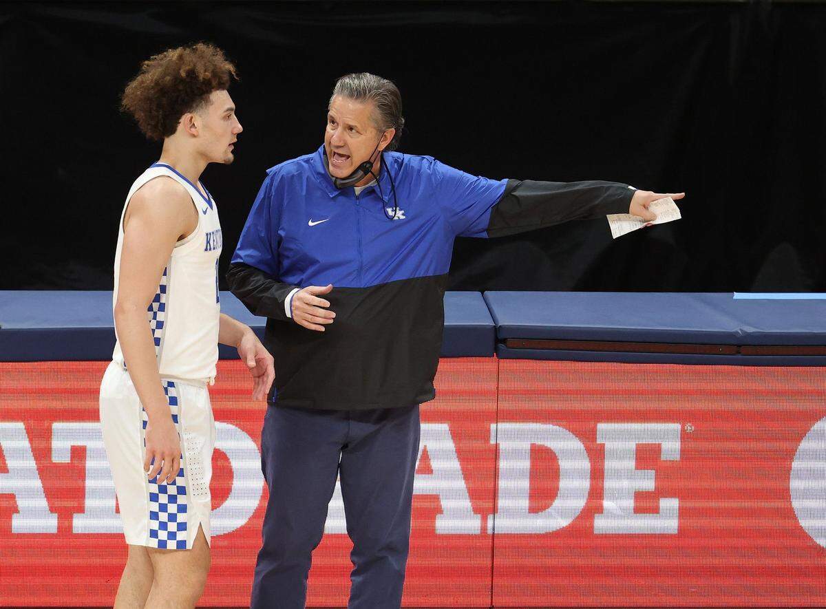 Kentucky Coach John Calipari, right, says some of the recent struggles of freshman point guard Devin Askew, left, come from “thinking too much.”
