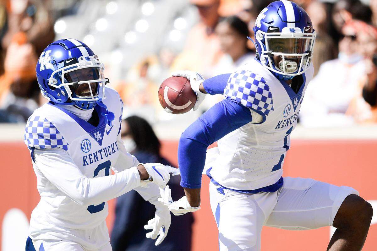 Kentucky defensive back Kelvin Joseph, right, celebrated after intercepting a pass and returning it for a touchdown during last Saturday’s win at Tennessee.