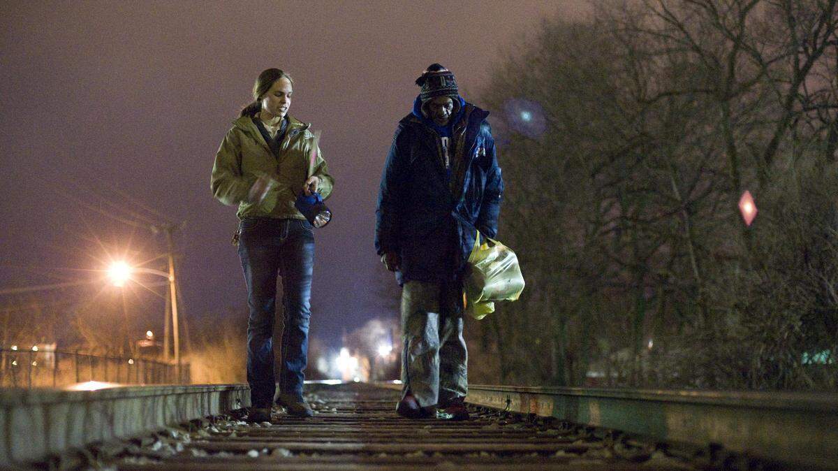 Carrie Berend, left, volunteer coordinator for the Catholic Action Center, and Street Voice Council chairwoman Ellis Boatley looked for people without shelter along railroad tracks behind the Catalina Motel during the 2013 Lexington Homeless Count on Jan. 31.