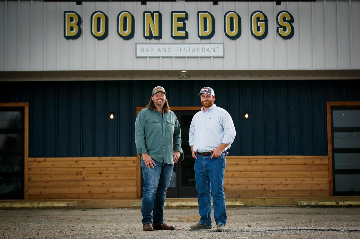 Boonedogs co-founders Tim Jones, left, and Hilary Boone, both of Lexington, in front of the restaurant out Old Richmond Road by Jacks Creek Pike. Boonedogs is on the way to and from Raven Run, so they hope it will become a popular stop for hikers and cyclists.