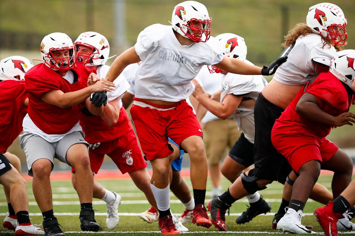 Chase Taulbee, center, ran drills with teammates during football practice this week in preparation for Friday’s game at Bryan Station.