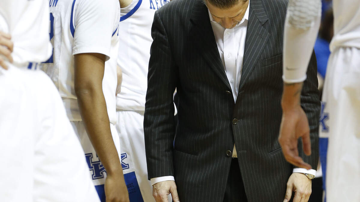 Kentucky Wildcats head coach John Calipari imitated Ryan Harrow, with his head down as he walked to the bench  as Vanderbilt defeated Kentucky 64-48 in the SEC tournament  on Friday March 15, 2013 in Nashville,TN. Photo by Mark Cornelison | Staff