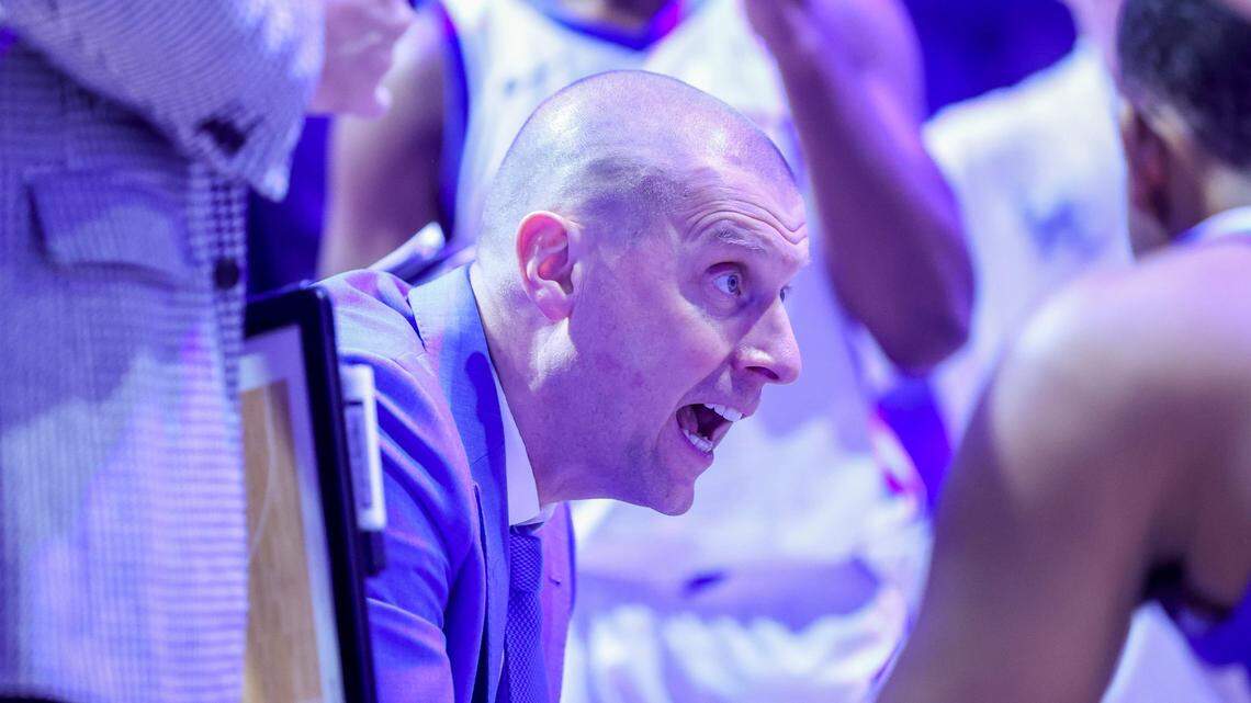 Kentucky head coach Mark Pope talks to his team during a second-half timeout against Louisville on Saturday night at Rupp Arena.