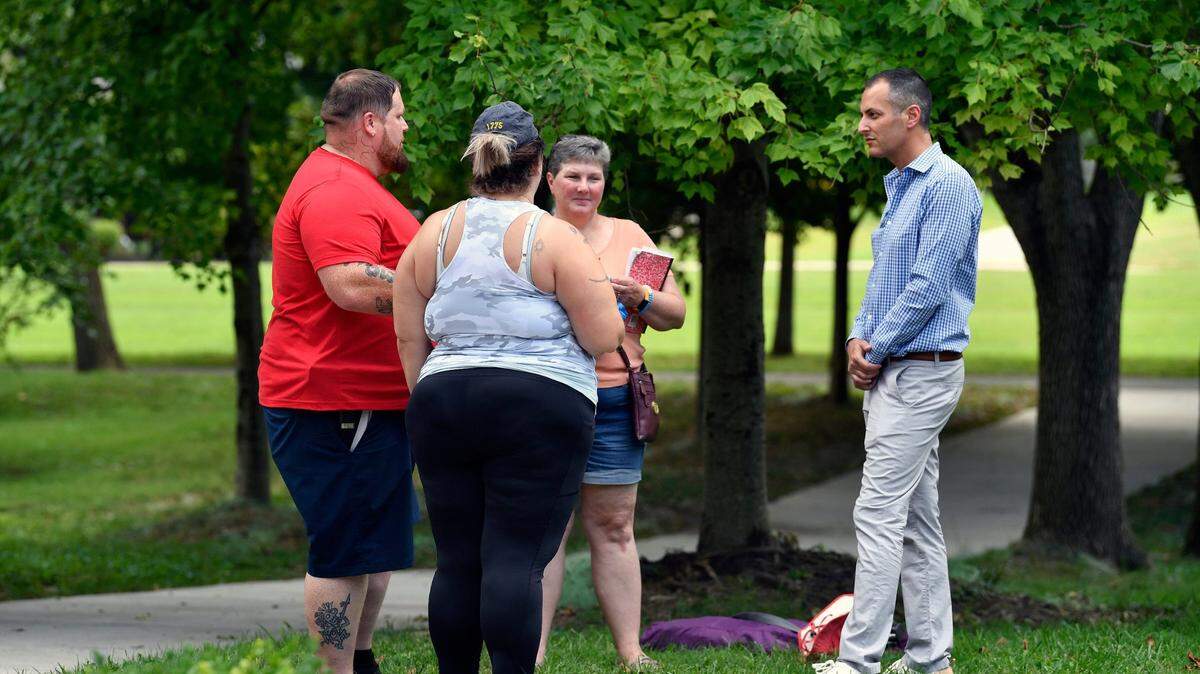 Kentucky State Representative Daniel Grossberg, right, speaks with parents about the difficulties they experienced with bus transportation during a conversation with JCPS parents at Brown Park, Sunday, Aug. 13 2023 in Louisville Ky.